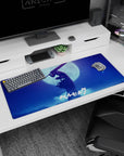 Artistic 36x16 inches desk pad showcasing Guts in his Berserker Armor under a full moon, perfect for adding raw emotion and dark fantasy style to your workspace.