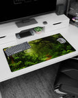 Lush 32x16 mouse pad with moss-covered trees, ferns, and vines for a tranquil, nature-inspired workspace design
