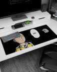 36x16 inches anime desk pad showing Saitama staring blankly, cape at collar, crisp yellow suit on black.