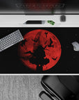 Moody dark fantasy anime desk pad 40x20 inches in deep reds fading to smoky black, cinematic and cozy.