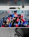 Neon red and electric blue Fairy Tail anime desk pad 40x20 inches with bold grit and friendship vibe.