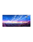 Mouse pad with a twilight cityscape, 28x12 inches, and a radiant starry sky, perfect for a serene yet inspiring workspace atmosphere.
