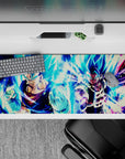 36x16 inches desk pad featuring Vegito and Gogeta in Super Saiyan Blue, perfect for fans who appreciate the power of these fusion warriors.