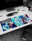 Artistic 36x16 inches desk pad with Vegito and Gogeta, radiating energy and power in their Super Saiyan Blue forms for a dynamic desk design.