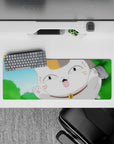 Bright blue and green anime mouse pad 32x12 inches with a playful smiling cat and warm orange patches.