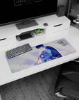 Anime mouse pad 32x12 inches showing dark-haired boy holding a crying blonde girl close under drifting petals.