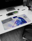 32x16 inches anime mouse pad showing dark-haired boy in blue jacket hugging a teary blonde girl close.