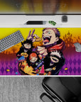 Playful 40x20 desk pad with Jujutsu Kaisen characters and candies pumpkins for spooky season enthusiasts