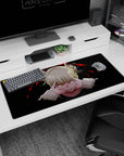 Artistic 36x16 inches desk pad with Himiko Toga, showcasing her sinister smile and piercing yellow eyes in a dark design.
