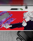 40x20 inches desk pad showcasing Gojo Satoru’s intense focus, with a dramatic red background and swirling purple energy from Jujutsu Kaisen.