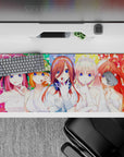36x16 inches rainbow confetti anime desk pad, bright blue-eyed brides, playful romantic secretive vibe.