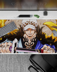 Epic 40x20 desk pad showcases Trafalgar Law's golden energy and signature smirk for fan admiration