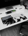 Detailed black and white Gojo Satoru art on 32x16 Jujutsu Kaisen mouse pad for anime-inspired desks
