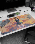 Shy anime schoolgirl in teal uniform under cottony sunset clouds and birds on desk pad 40x20 inches.