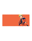28x12 inches anime mouse pad with minimalist Naruto-style design and wide orange background.