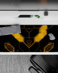 36x16 inches matte black anime desk pad with glowing amber lines, sleek techy vibe, subtle neon glow.