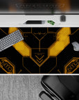 Matte black anime desk pad with glowing amber HUD lines, subtle sci-fi vibe, 40x20 inches.