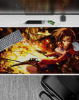 Fiery orange-gold anime desk pad 40x20 inches with smoky shadows, red jacket, and spark glow.