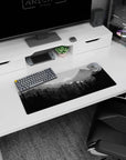 Calming 28x12 mouse pad with a serene wilderness scene in calming shades of gray, perfect for a peaceful desk atmosphere