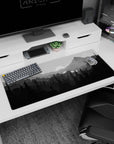 Calming 36x16 anime desk mat with shades of gray and a serene wilderness landscape, ideal for a nature-inspired, peaceful workspace