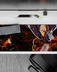 36x16 inches anime desk pad in warm orange glow and deep shadows, smoky fire mood, calm hero focus.