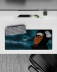 28x12 inches anime mouse pad in dark black tones with warm orange mask highlights and moody blue-gray clouds.