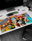 Spiky red-haired hero pointing out on anime desk pad 40x20 inches, with pink and silver fighters behind.