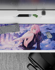 Winter dreamscape 36x16 desk pad featuring Zero Two against a serene snowy backdrop, blending soft purples and golden sunset hues for an elegant contrast