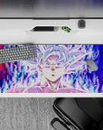 36x16 inches desk pad showcasing Goku’s calm yet powerful stance in Mastered Ultra Instinct, with glowing energy surrounding him.