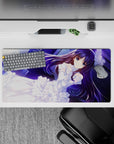 Romantic, calm anime desk mat 32x16 inches in deep violet and neon blue with snowy lace highlights.