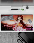 Dreamy anime girl mouse pad 32x16 inches in warm apricot sky, rosy reds and gold glow, soft sunset vibes.