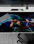 40x20 inches desk pad with Zoro from One Piece, showcasing his battle stance alongside a blue dragon, symbolizing his power and determination.