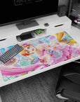 Wide-eyed orange-haired anime idol in a candy-glass ballroom desk pad 40x20 inches with floating sweets.