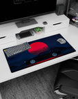 Modern 32x16 inches mouse pad featuring the Midnight Skyline Eclipse, showcasing a bold black car and a red moon against a dark blue night sky.