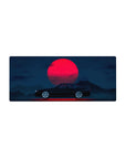 Mouse pad featuring the Midnight Skyline Eclipse, 28x12 inches, with a black car and a vibrant red moon against a deep blue night sky.