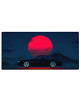 Mouse pad featuring the Midnight Skyline Eclipse, 32x16 inches, with a black car and vibrant red moon set against a deep blue night sky.
