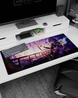 Silver-haired anime girl with katana pose before a glowing city skyline desk pad, 36x16 inches.