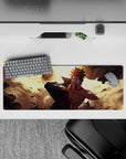 32x12 inches anime desk mat in warm gold light with flying rubble, bold contrast, and chaotic energy.