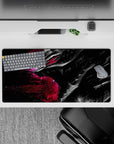 32x16 inches mouse pad with Guts in his Berserker Armor in front of a vibrant galactic backdrop, capturing the cosmic chaos and inner turmoil of the Black Swordsman.