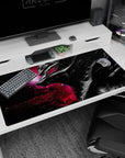 Large 40x20 inches desk pad featuring Guts in his Berserker Armor with a galactic backdrop, perfect for adding bold intensity and cosmic chaos to your workspace.