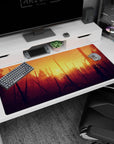 Large 40x20 inches mouse pad showcasing a sunset forest with warm oranges and golds, perfect for inspiring creativity and adventure.