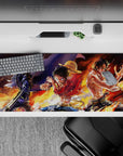 Striking 36x16 desk pad highlights Sanji Luffy Ace's fiery connection and teamwork for fan admiration