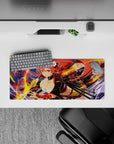 Anime girl mouse pad 28x12 inches in warm reds and gold, midnight sky backdrop with swirling flame arcs.