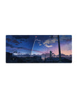 28x12 inches anime mouse pad with city rooftop silhouettes, power lines, and a rocket trail at dusk.