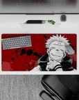 Dark-themed 32x16 mouse pad showcasing Sukuna's chilling cursed spirit energy from Jujutsu Kaisen
