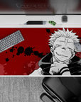 Dark and eerie 40x20 desk pad showcasing Sukuna's sinister cursed spirit energy from Jujutsu Kaisen