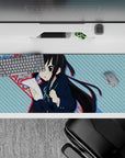36x16 inches anime girl mouse pad in cool blue stripes and punchy red text, cute-serious vibe for desk setups.