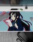 40x20 inches kawaii anime desk pad in cool blue tones with punchy red text, calm study vibe.