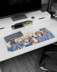 32x12 inches anime girl mouse pad showing uniformed girls crowding together, one winks, one shy smile.