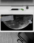 Deep black and dusty gray moon mouse pad, 32x16 inches, calm night-sky mood with soft glow.